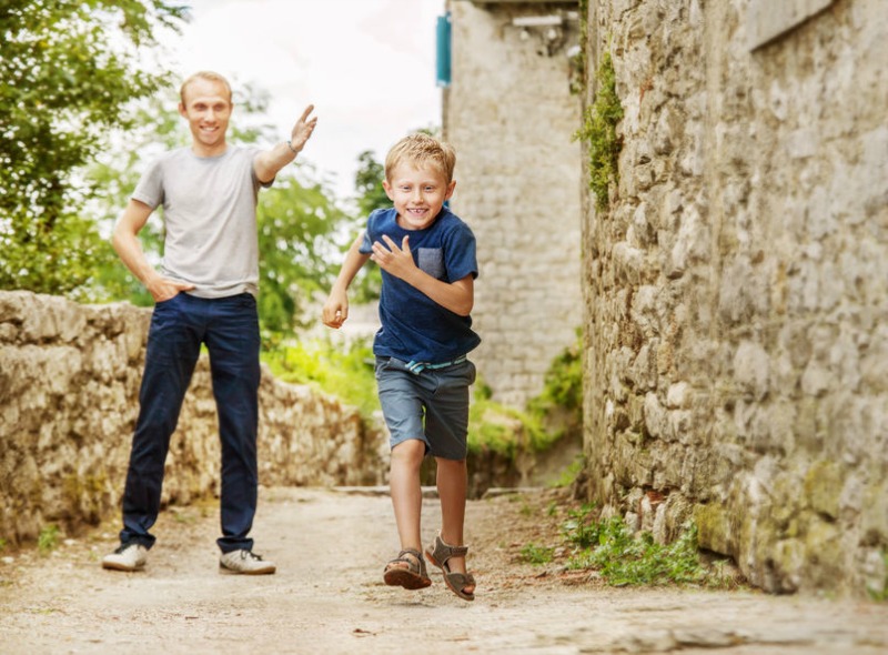 Father Encourages His Son to Race Toward His Goals