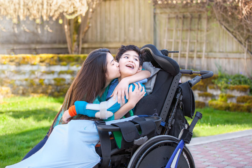 Boy in Wheelchair Receives Big Loving Hug