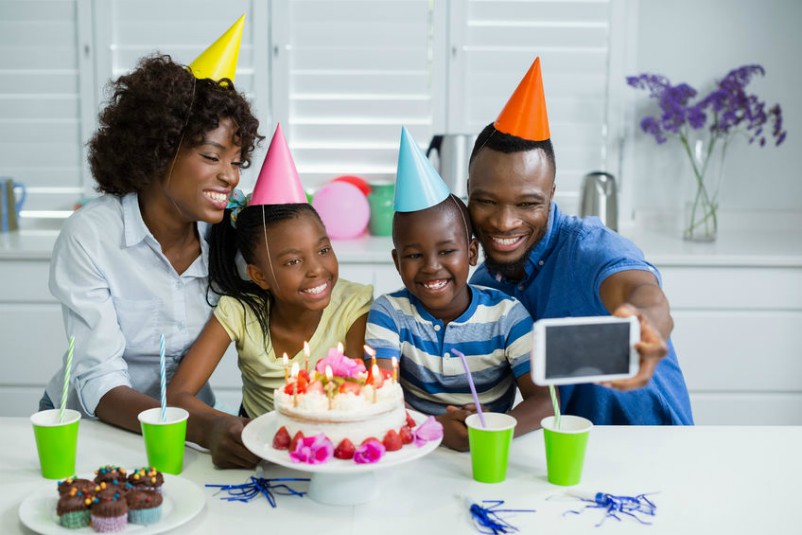 Young Family Creating Birthday Memories