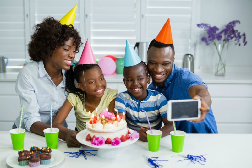 Young Family Creating Birthday Memories