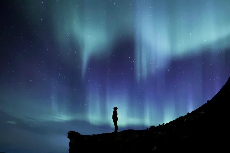 Man Staring Into Heaven Asking, "Is There a God?"