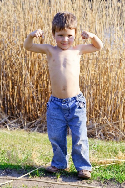 Little Boy Feels Strong for Daddy